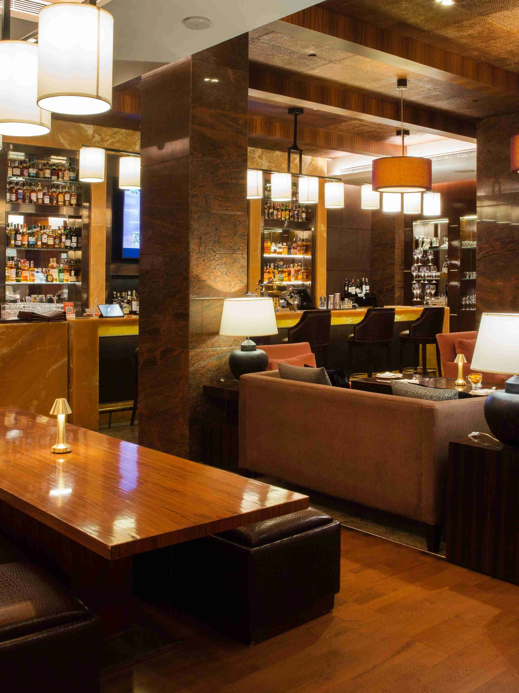 DLF The Magnolias — residents' club lounge — Residents' clubhouse reference, not the offered home. Membership, access and charges are governed by current terms.