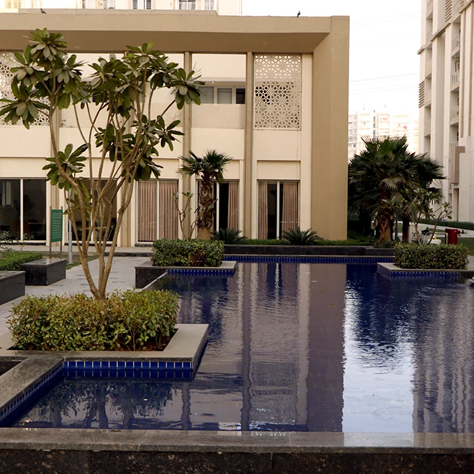Emaar Gurgaon Greens — water feature and arrival detail — Developer project photograph/reference; not the offered unit. Current condition and access rights must be confirmed.