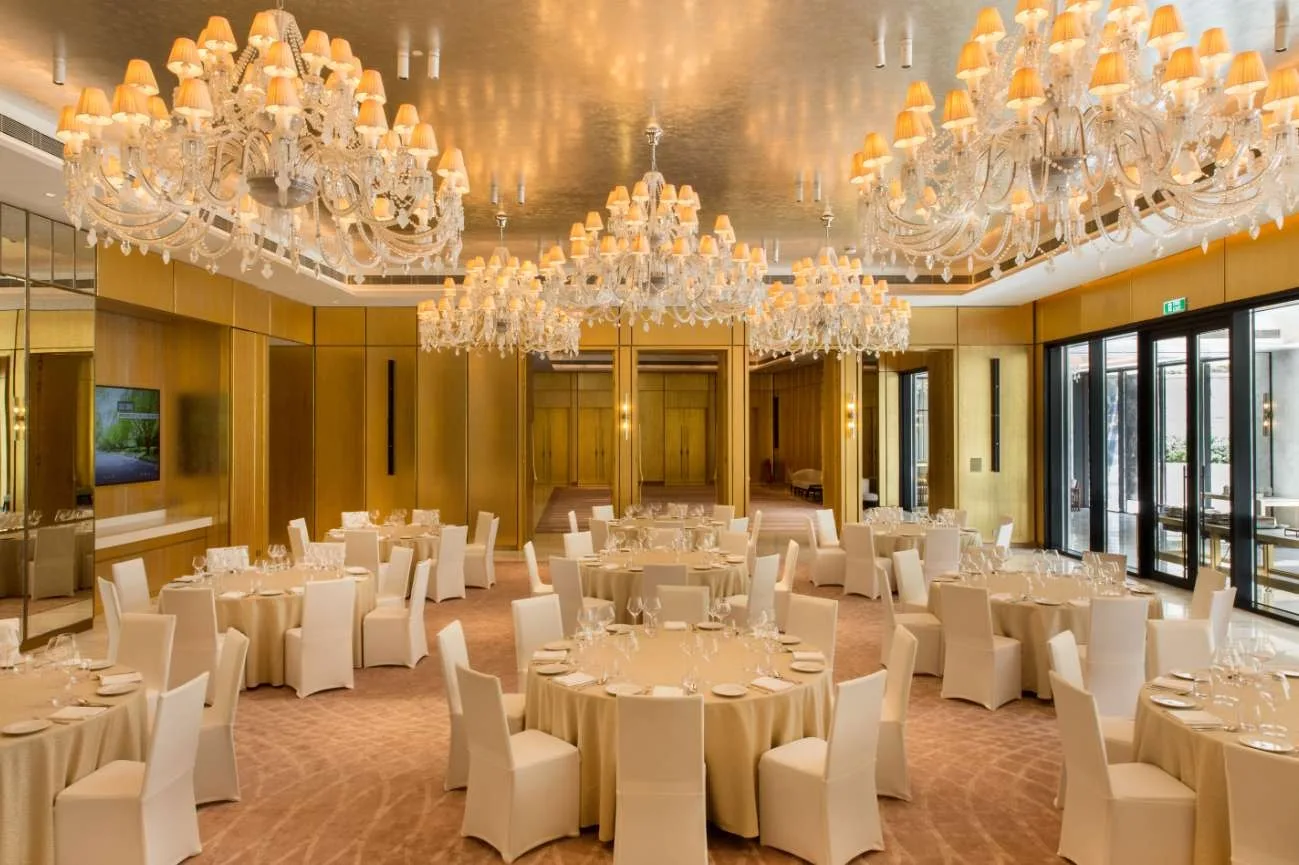 DLF The Camellias — club banquet room — DLF Hospitality club photograph; membership and access terms apply. Not the offered residence.