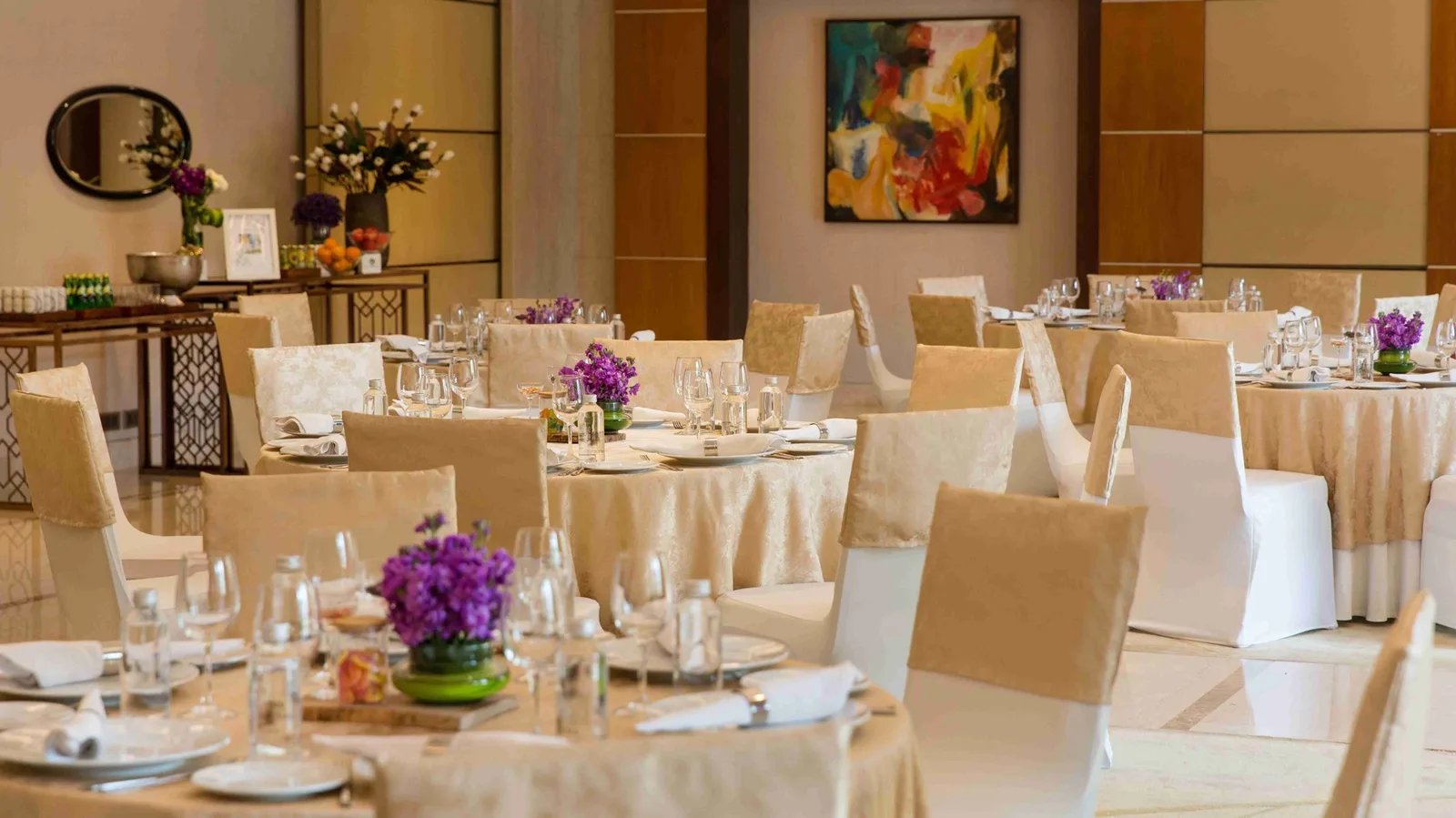DLF The Magnolias — club banquet hall — DLF Hospitality club photograph; membership and access terms apply. Not the offered residence.