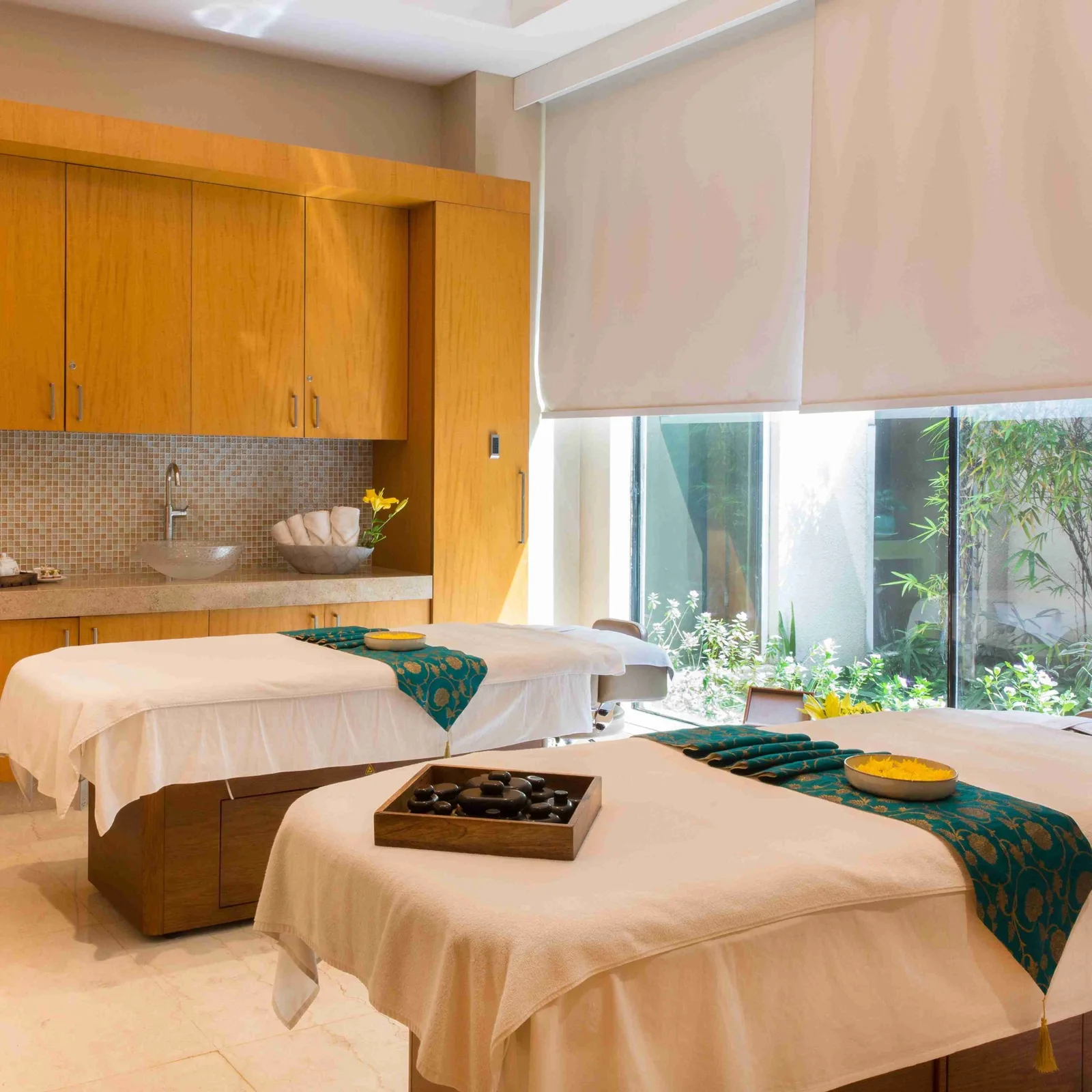 DLF The Magnolias — club spa treatment room — DLF Hospitality club photograph; membership and access terms apply. Not the offered residence.